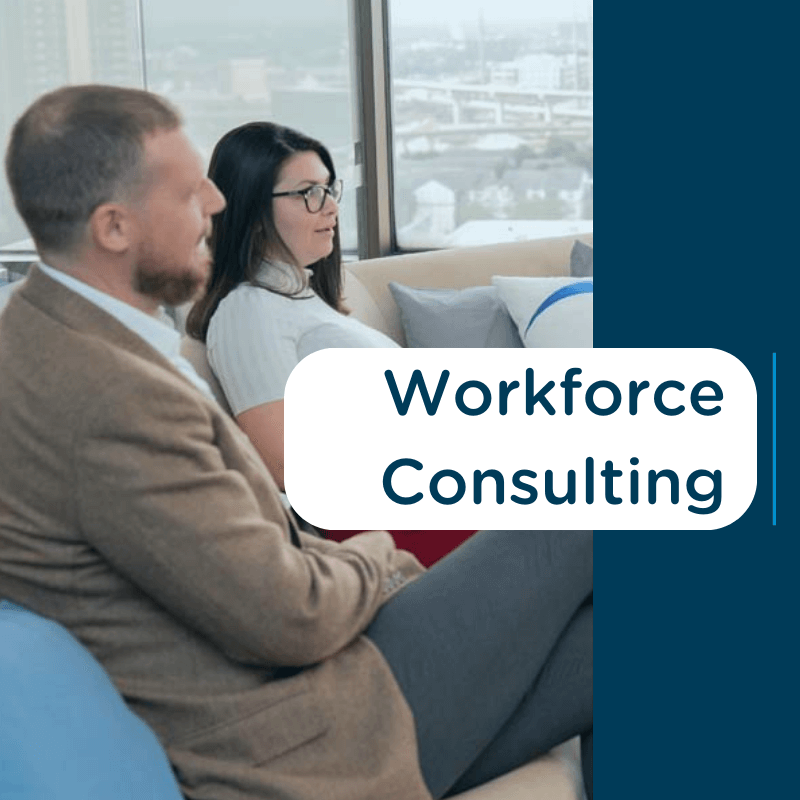 Two professionals discussing in a high-rise office with text 